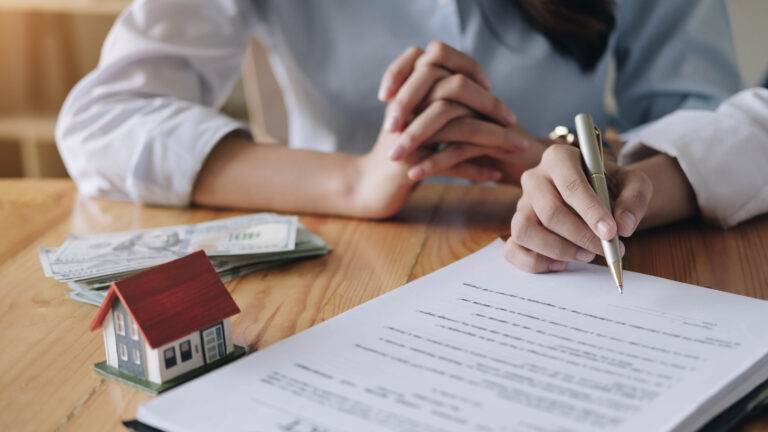 Close-up of agent review contract with client. Concessions, Inspection Objections and Contingencies