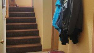 Entry way with brown carpet