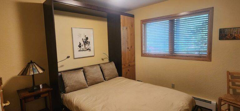 Primary bedroom with tan bedding